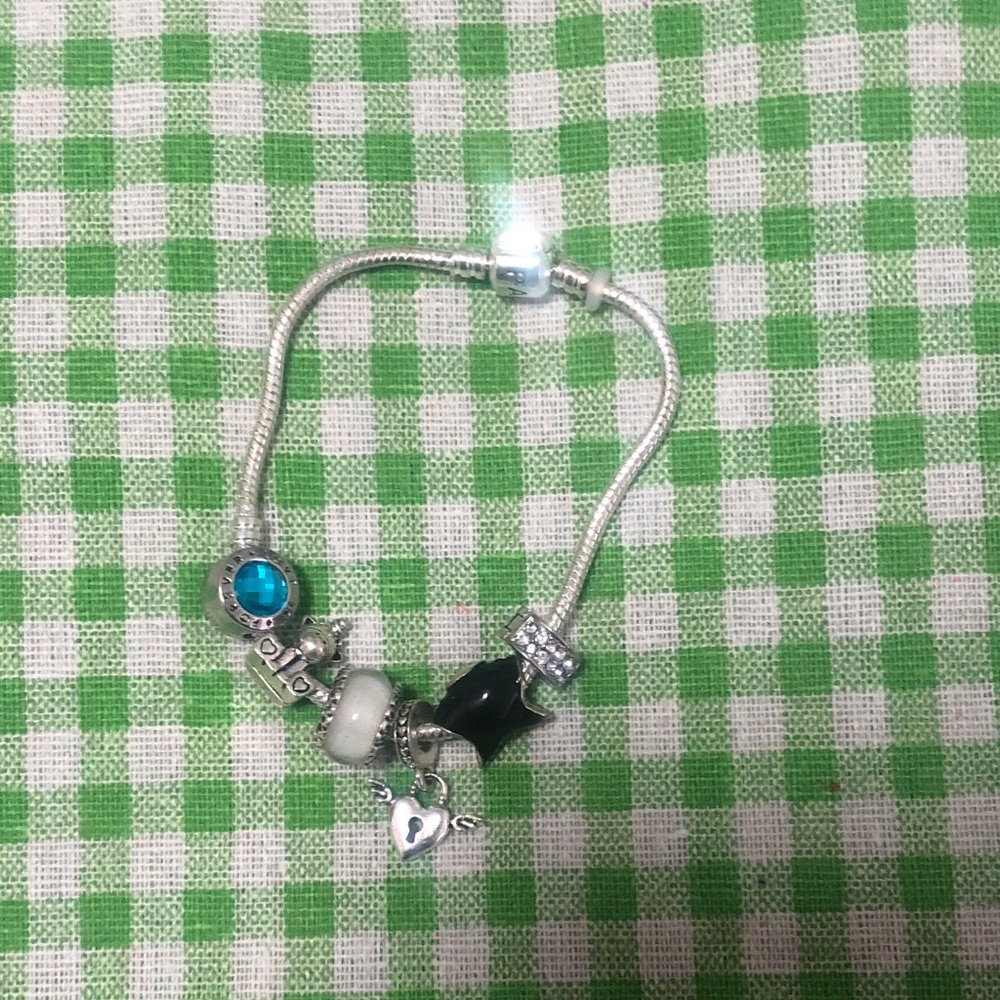 Elegant Silver Charm Bracelet with Black and Blue Accents
